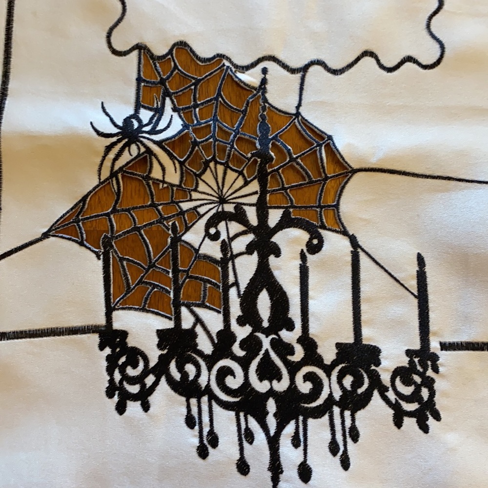 Halloween spiderwebs and chandelier table runner
